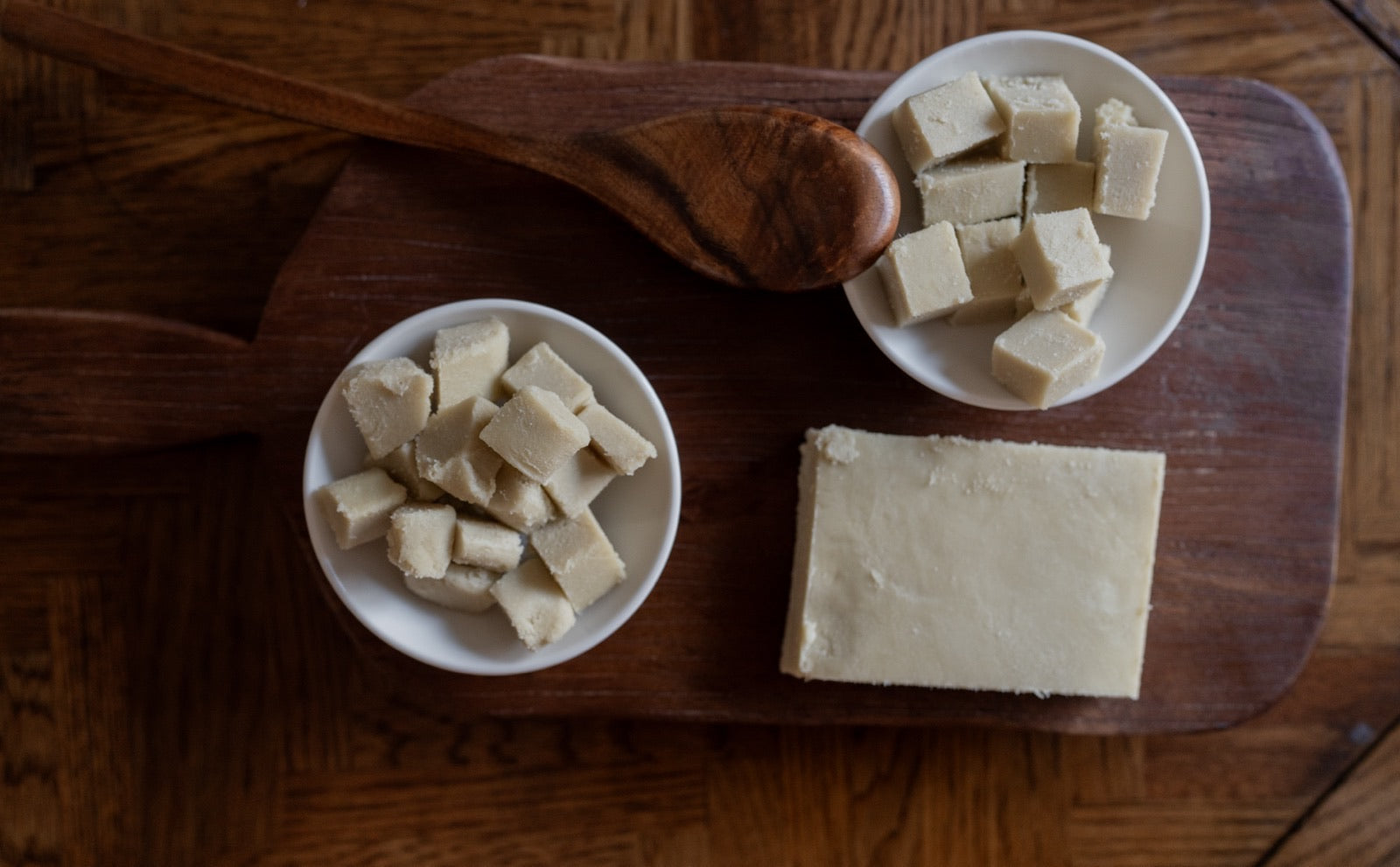 Raw African shea butter on cutting board